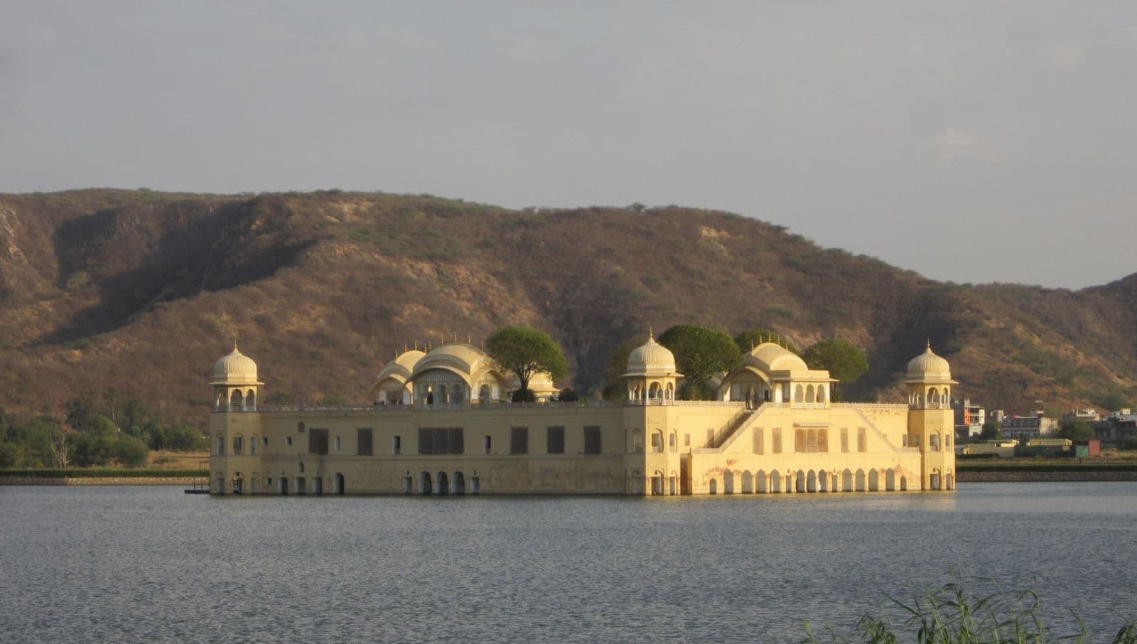 Jal Mahal, a palace standing in the middle of Man Sagar lake below rocky hills